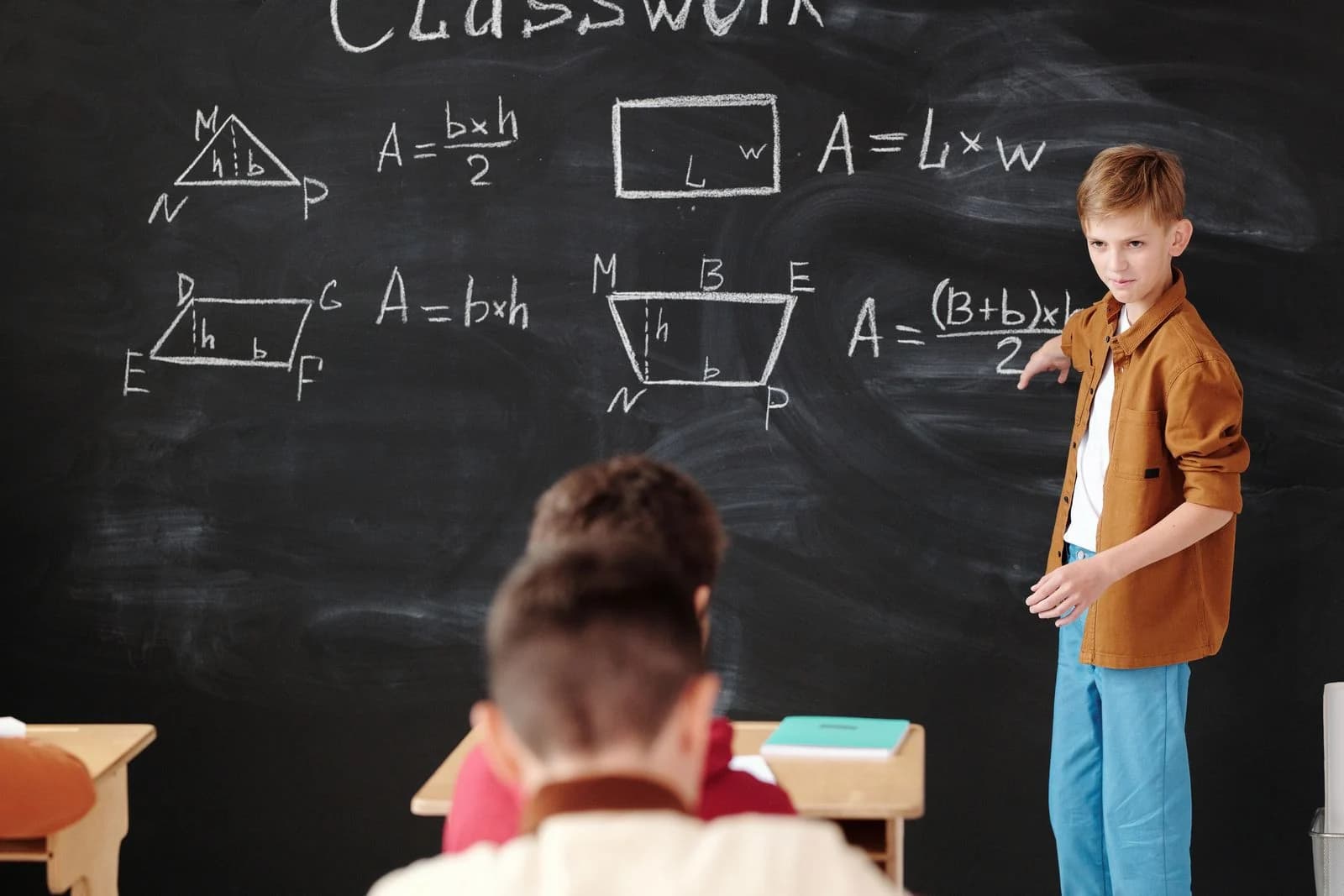 Student presenting a solution at a mathematics board